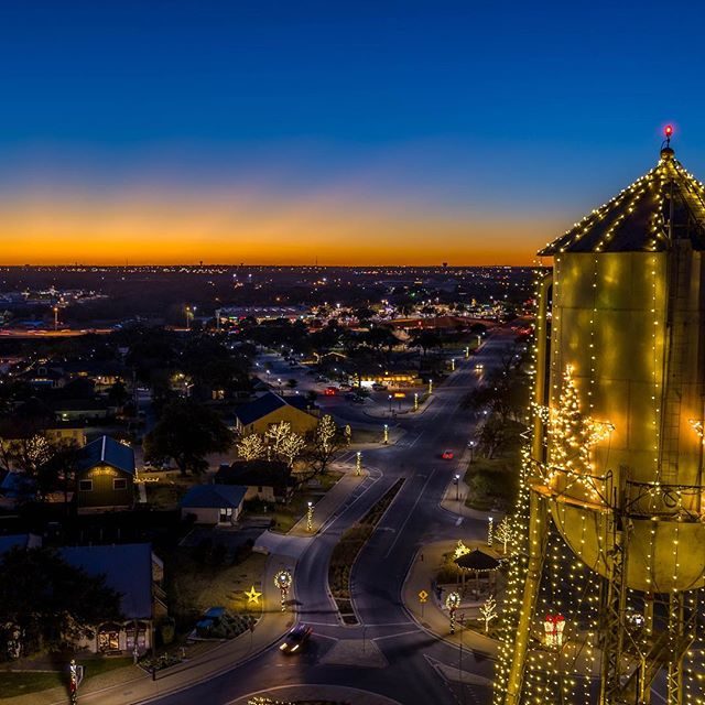 Aerial night photography of a Texas bridge with McGlam Stadium beyond